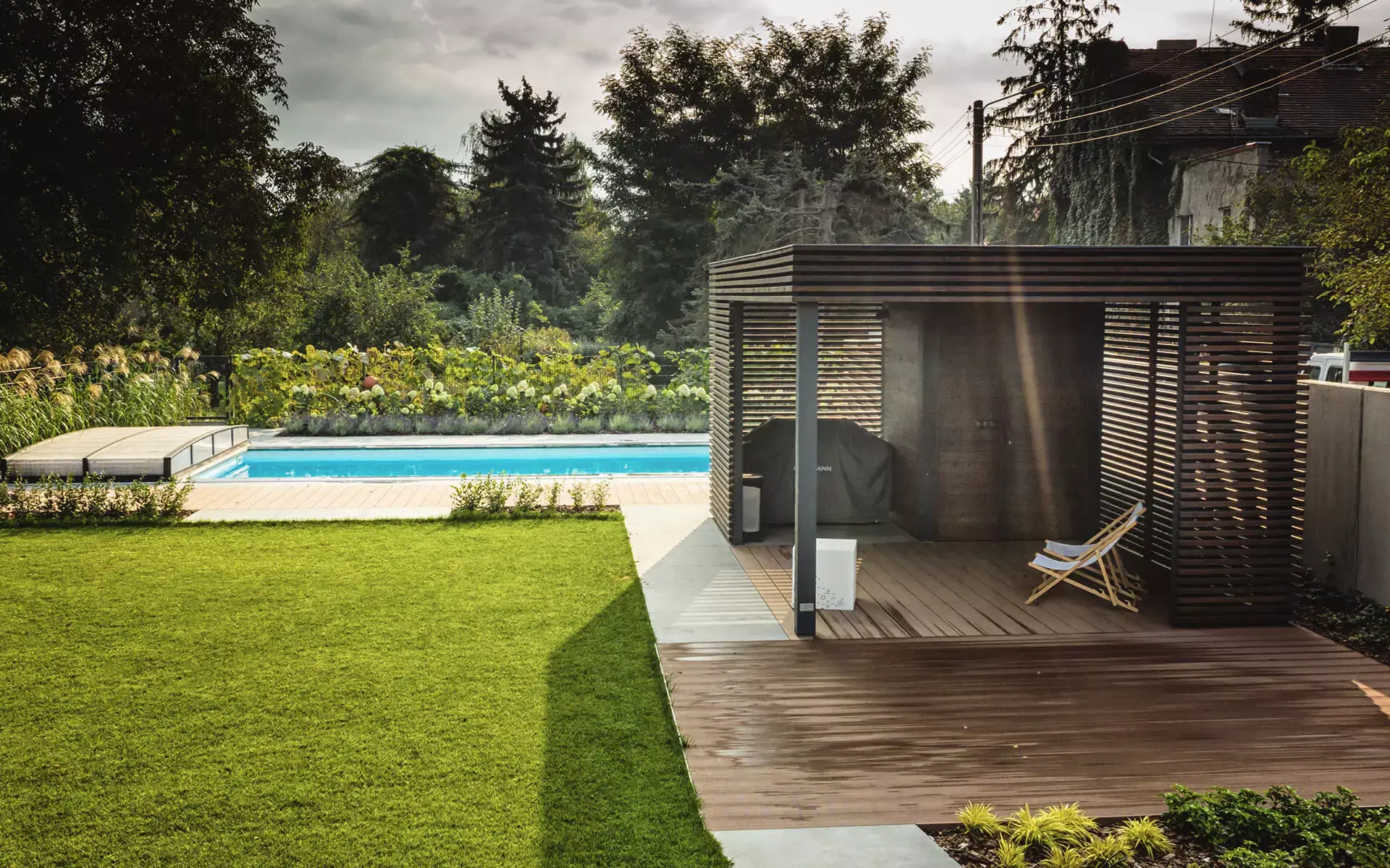 Pinegard timber garden architecture with open and glazed sections.